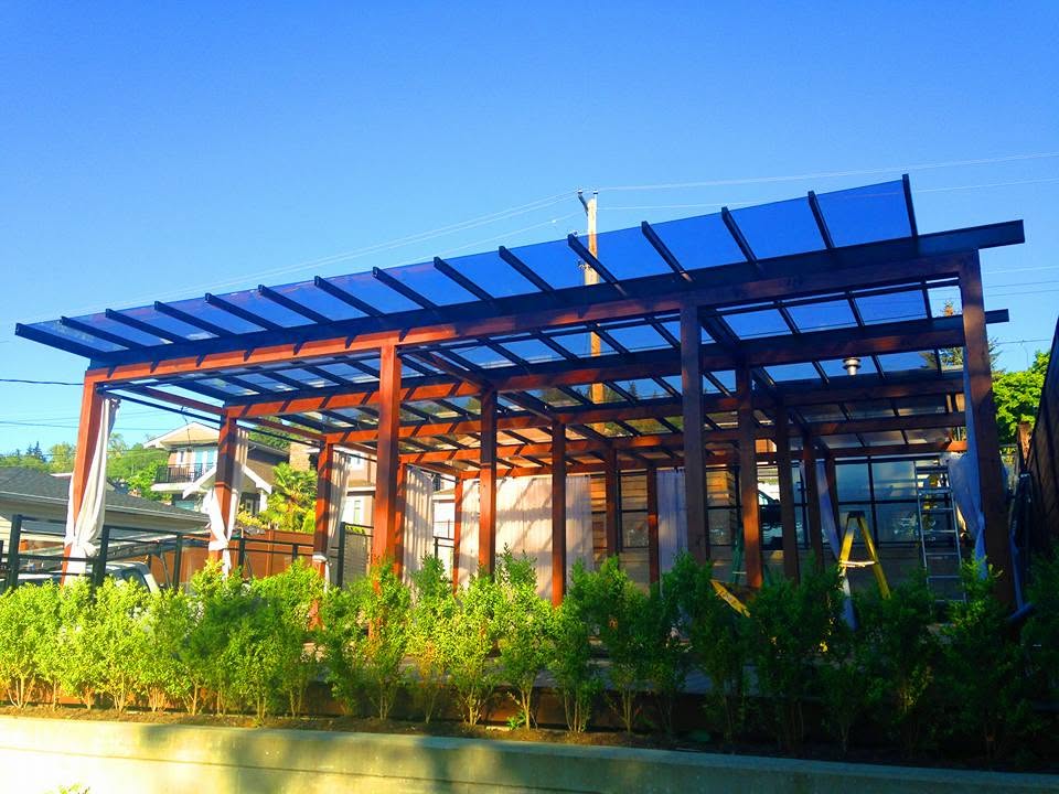 Patio cover structure over an outdoor living area