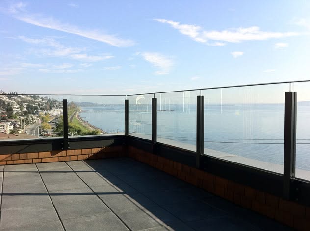 Frameless glass railing on a terrace overlooking the ocean