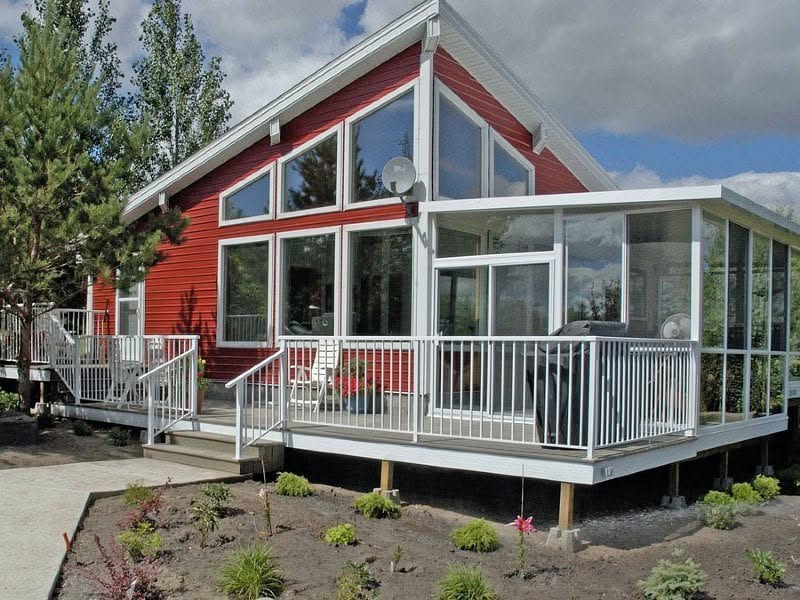 Glass solarium addition on the exterior of a home